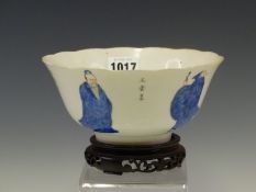 A CHINESE BOWL WITH WOOD STAND, THE EXTERIOR PAINTED IN LIBAI STYLE WITH FOUR OVER GLAZE BLUE