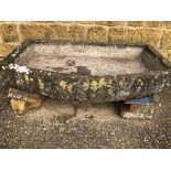 A BOWED STONE SINK. 136 x 77 x 21 cms. VIEWING FOR THIS ITEM IS BY APPOINTMENT ONLY, AND IS NOT AT