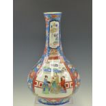 A JAPANESE IMARI OVERGLAZE BLUE GROUND BOTTLE VASE PAINTED WITH TWO FIGURE RESERVES. H 34cms.