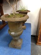 A SET OF FOUR OLD IRON GARDEN URNS WITH GADROONED BASES ABOVE THE SOCLES ON SQUARE FEET. Dia. 33 x H