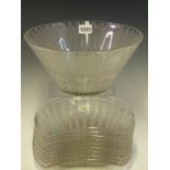 NINE LALIQUE JAFFA PATTERN CRESCENT SHAPED SALAD PLATES TOGETHER WITH A BOWL. Dia. 25.5cms.