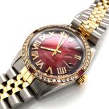 ROLEX OYSTER PERPETUAL DATE JUST MODEL16013 , SERIAL NUMBER 6475199. CUSTOM RUBY RED DIAL WITH
