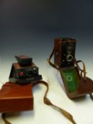 A ROLLEIFLEX TLR CAMERA, A POLAROID SX-70 LAND CAMERA IN ORIGINAL LEATHER POUCH, A KODAK VINTAGE