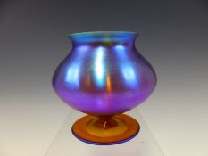 ATTRIBUTED TO WMF, A MAUVE IRIDESCENT GOBLET SHAPED GLASS VASE. H 10cms.