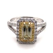 A TRESOR PARIS YELLOW AND WHITE DIAMOND RING. THE PRINCIPLE YELLOW DIAMOND APPROX 1.04cts.