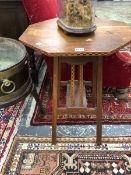 AN ARTS AND CRAFTS OAK OCTAGONAL TABLE WITH CHEQUER INLAID EDGE AND PAIR OF STRUTS TO TWO SIDES