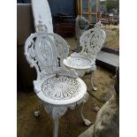 A PAIR OF PAINTED CAST IRON PATIO CHAIRS.