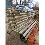 A TEAK SLATTED GARDEN BENCH WITH WROUGHT IRON SUPPORTS. H 90 x W 153 x D 85cms