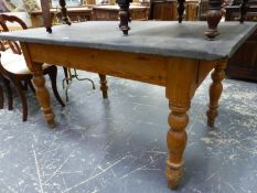 A VICTORIAN PINE SLATE TOPPED PINE TABLE WITH DRAWERS AT EACH END WITH WHITE CERAMIC KNOB HANDLES. W