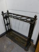 AN ANTIQUE COALBROOKDALE STYLE CAST IRON STICK STAND, THE TOP WITH SIX CIRCULAR HOLDERS, THE CENTRAL