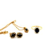 AN SAPPHIRE AND DIAMOND SUITE OF JEWELLERY CONSISTING OF A PAIR OF STUD EARRINGS, A PENDANT AND