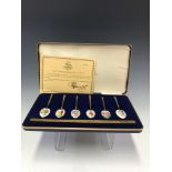 A CASED SET OF SIX FLORAL ENAMELLED AND GILT COFFEE SPOONS BY THE BIRMINGHAM MINT, 1978, LIMITED