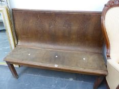 A 20th C. PINE BENCH, THE PLYWOOD BACK DRILLED WITH SIX GOTHIC ARCH SHAPES. W 129cms.