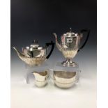 A MATCHED SILVER FOUR PIECE TEA AND COFFEE SET, THE TEA POT, TWO HANDLED SUGAR AND MILK JUG BY