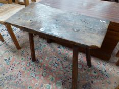 A 19th C. OAK RUSTIC TABLE, THE PLANK TOP ON FOUR POLYGONAL LEGS. W 74 x D 38 x H 56cms.