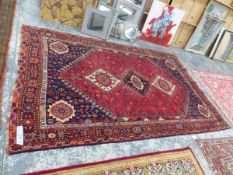 A PERSIAN SHIRAZ CARPET 310 x 193 cm