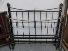A LATE VICTORIAN BLACK PAINTED IRON DOUBLE BED WITH POLISHED BRASS TOP RAILS, TO TAKE A MATTRESS.