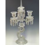 A BACCARAT THREE LIGHT LUSTRE CANDELABRUM, THE CLEAR GLASS WITH FROSTED DETAILS, THE DOLPHIN