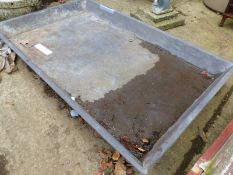 A LARGE LEAD PIG TRAY