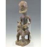 AN EARLY 20th C. DOGON MAHOGANY FIGURE OF A BEARDED NAKED MAN RIDING A HORSE. H 31cms.