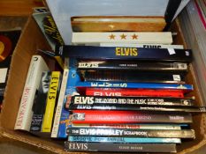 A COLLECTION OF ELVIS PRESLEY MEMORABILIA, INCLUDING BOOKS, VIDEOS, CUTTINGS ETC