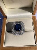 A SAPPHIRE AND DIAMOND ART DECO STYLE RING. THE SAPPHIRE APPROX TOTAL WEIGHT 2.45cts, DIAMOND WEIGHT