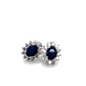 A PAIR OF 9ct WHITE GOLD HALLMARKED SAPPHIRE AND DIAMOND CLUSTER EARRINGS. WEIGHT 4.13grms