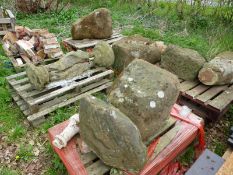 SIX LARGE ANTIQUE STADDLE STONE BASES TOGETHER WITH A CARVED STONE PLINTH FOR RESTORATION.