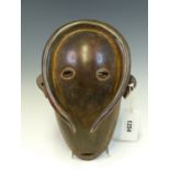 A MAHOGANY MASK, LATE 19th C. ZAIRE, THE POLISHED OVAL FACE PIERCED WITH EYES AND MOUTH, A
