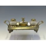 AN EARLY 19th C. BRONZE INKSTAND WITH GADROONED HANDLES AND RIM, THE CENTRAL SEALING WAX BOX FLANKED