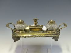 AN EARLY 19th C. BRONZE INKSTAND WITH GADROONED HANDLES AND RIM, THE CENTRAL SEALING WAX BOX FLANKED