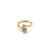 AN 18ct GOLD HALLMARKED TWO STONE DIAMOND MARQUISE CUT RING. FINGER SIZE O. WEIGHT 3.08grms.