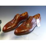 A PAIR OF BROWN LEATHER EDWARD GREEN OF NORTHAMPTON MENS BROGUE SHOES SIZE 10 1/2.