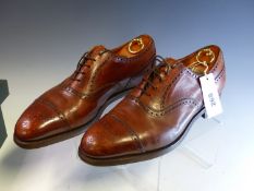 A PAIR OF BROWN LEATHER EDWARD GREEN OF NORTHAMPTON MENS BROGUE SHOES SIZE 10 1/2.
