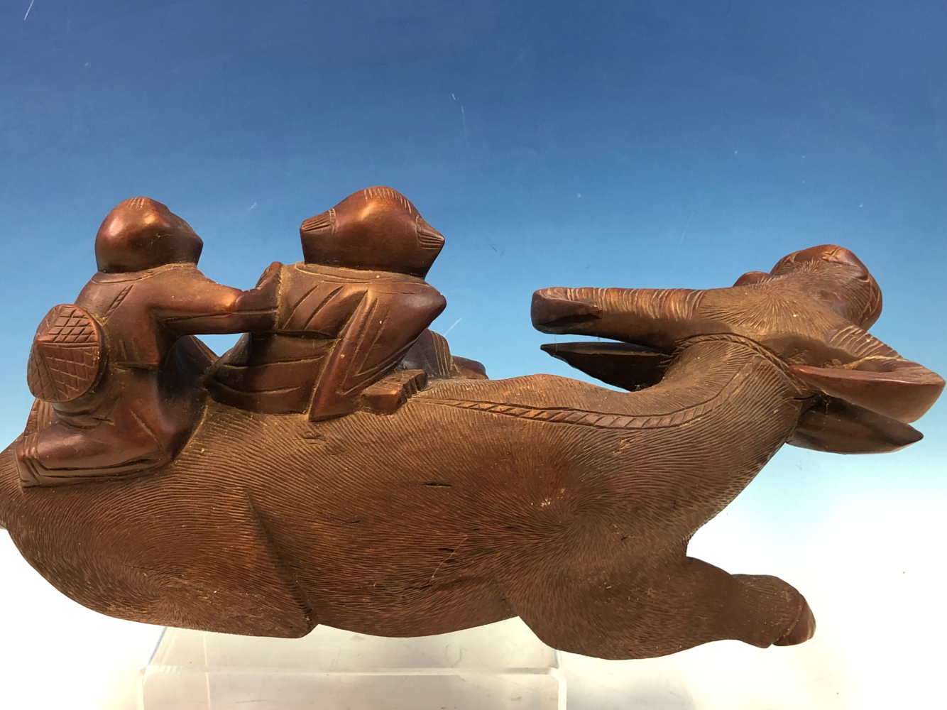 A CHINESE HARDWOOD CARVING OF TWO CHILDREN ON THE BACK OF A GLASS EYED RECLINING BUFFALO. W 33cms. - Image 9 of 9