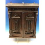 A VINTAGE OAK TWO DOOR SMALL TABLE CABINET WITH FITTED INTERIOR.44cm HIGH
