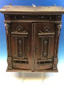 A VINTAGE OAK TWO DOOR SMALL TABLE CABINET WITH FITTED INTERIOR.44cm HIGH