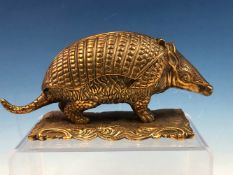 A LATE 19th C. POLISHED BRASS ARMADILLO INKWELL. W 18cms.