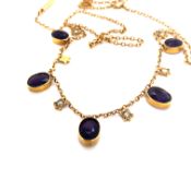 AN ANTIQUE EDWARDIAN AMETHYST AND PEARL GARLAND NECKLACE. UNHALLMARKED AND ASSESSED AS 9ct GOLD.