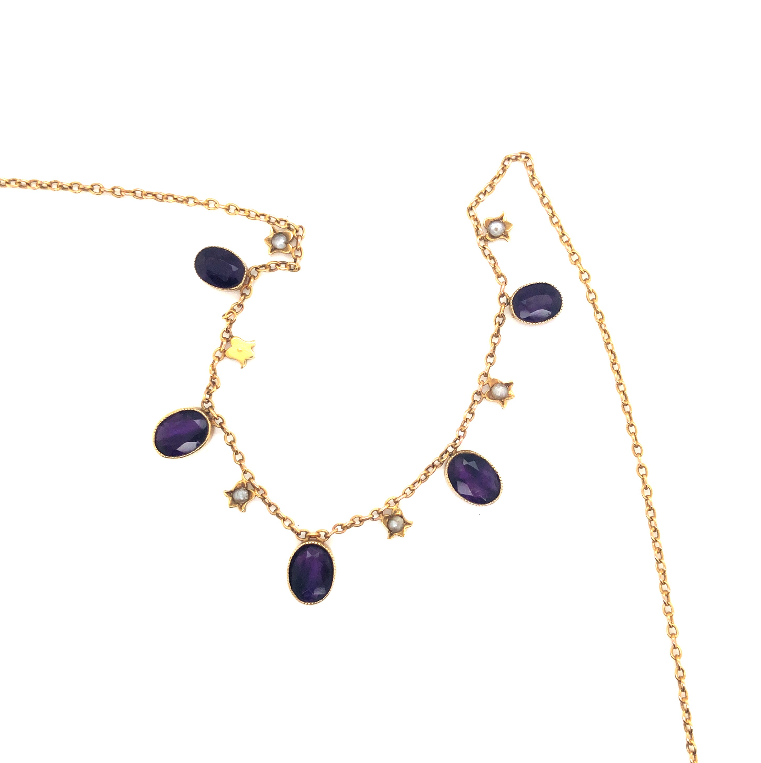 AN ANTIQUE EDWARDIAN AMETHYST AND PEARL GARLAND NECKLACE. UNHALLMARKED AND ASSESSED AS 9ct GOLD. - Image 2 of 3