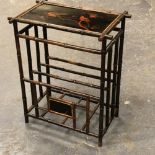 AN EARLY 20TH CENTURY BAMBOO CANTERBURY / NEWSPAPER STAND WITH JAPANESQUE LACQUER DECORATED PANELS