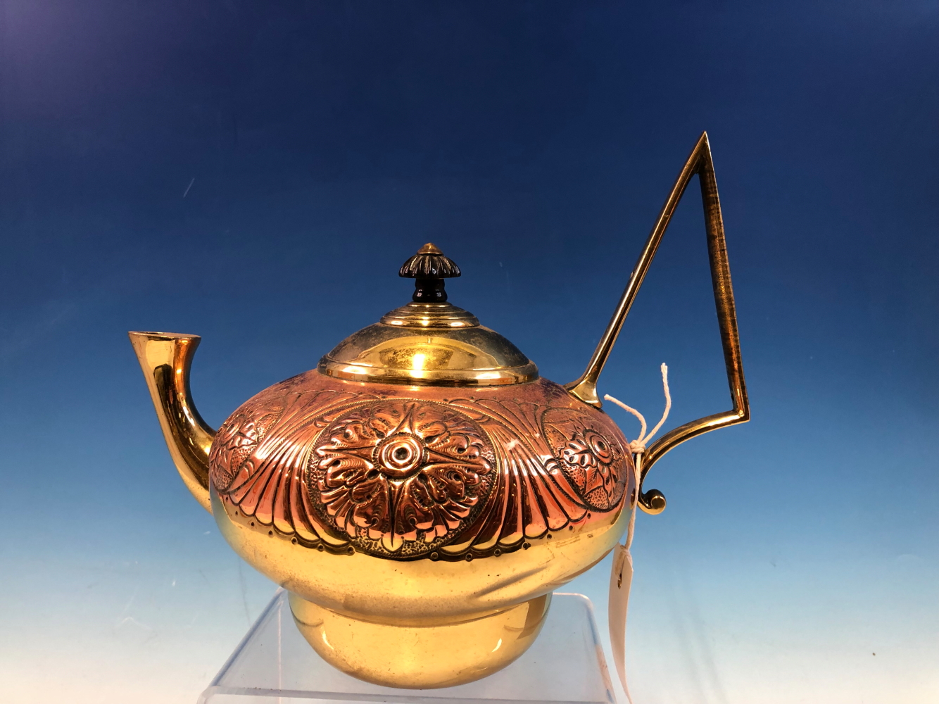 AN ARTS AND CRAFTS PERIOD COPPER AND BRASS KETTLE BY WILLIAM SOUTER AND SONS