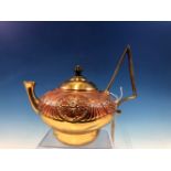 AN ARTS AND CRAFTS PERIOD COPPER AND BRASS KETTLE BY WILLIAM SOUTER AND SONS