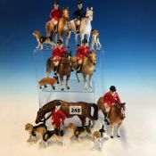 SEVEN BESWICK STYLE POTTERY HUNTSMEN WITH HORSES, SIX HOUNDS AND A FOX, SOME STAMPED FOREIGN