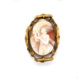 AN ANTIQUE CAMEO DEPICTING ZEUS AND GANYMEDE MOUNTED IN A GILDED SCROLL METAL AND BAR FRAME.