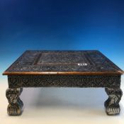 A SMALL EASTERN DESIGN LOW OCCASIONAL TABLE 38 X 38 CM