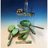 TWO GREEN ENAMELLED SILVER MOUNTED DRESSING TABLE SETS, BIRMINGHAM 1934, THE THIRTEEN PIECES
