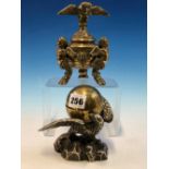 A SILVERED EAGLE BEARING A BRASS TERRESTIAL GLOBE INKWELL ON ITS SPREAD WINGS TOGETHER WITH A