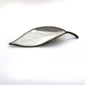 A VINTAGE SILVER AND WHITE ENAMEL LEAF BROOCH FOR DAVID ANDERSEN, NORWAY. LENGTH 7cms. WEIGHT 8.