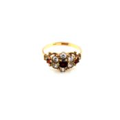 A HALLMARKED 9ct GOLD, GARNET AND CUBIC ZIRCONIA CLUSTER DRESS RING. FINGER SIZE N 1/2. WEIGHT 2.